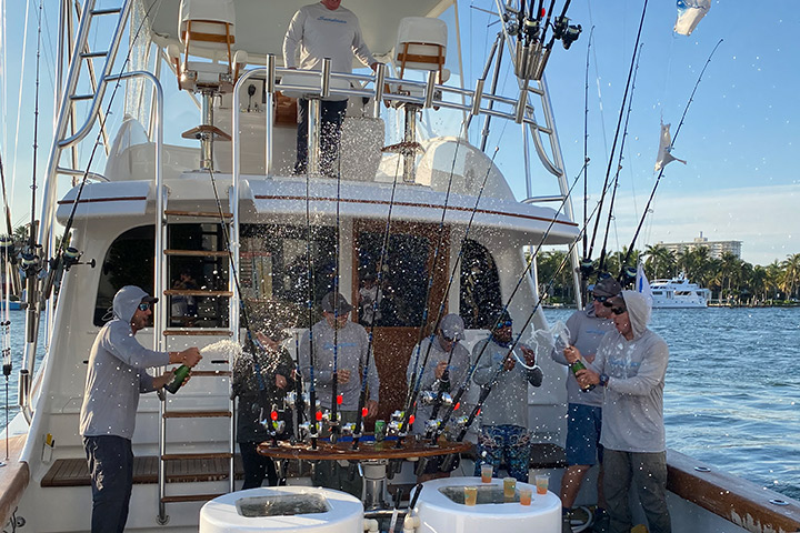 Championship team spraying champagne after being awarded the ring